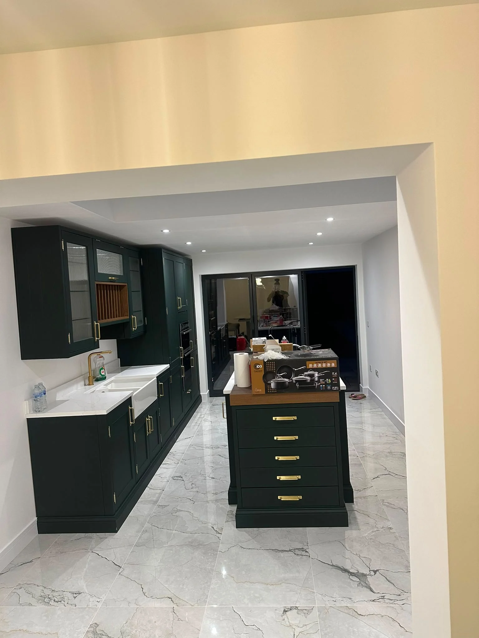 Dark green shaker kitchen with island and marble-effect floor — RV Renovation, Oxford